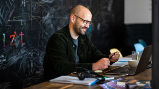 Ed sat by the chalkboard in the studio